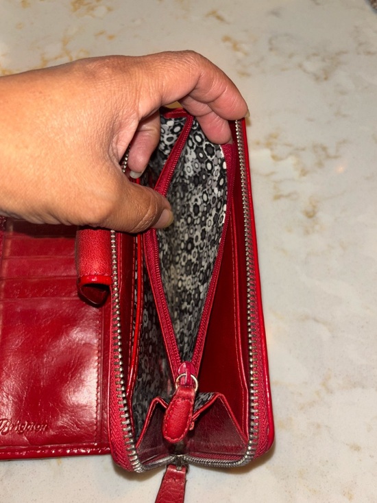 Brighton Red leather wallet featuring a decorative silver-toned snap closure. - Picture 11 of 16